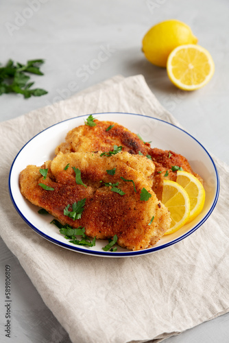 Homemade Chicken Cutlets on a Plate, side view.
