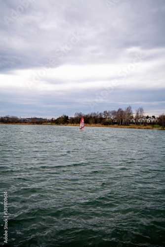 Windsurfing on a lake in the middle of the city of Krakow, Poland.