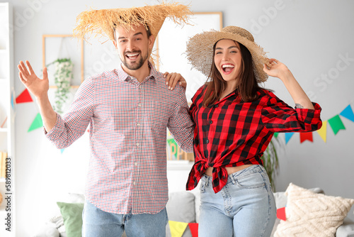 Young couple celebrating Fe...