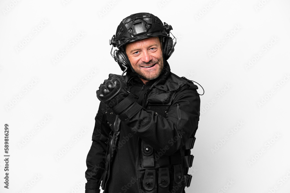 Middle age SWAT man isolated on white background celebrating a victory Middle age SWAT man isolated on white background celebrating a victory