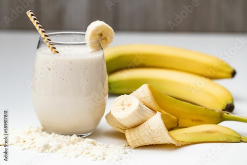 Milkshake with bananas in white background