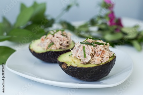 Plate with stuffed avocados cut in half