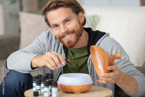 man receiving nasal inhalation by essential oil