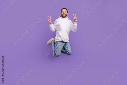 Bild auf Leinwand Full body photo of youngster eco friendly model hispanic man jump hoodie adidas