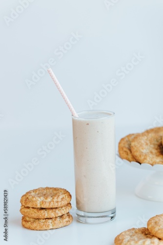 Vertical of the fresh milkshake with cookies isolated on the empty white background