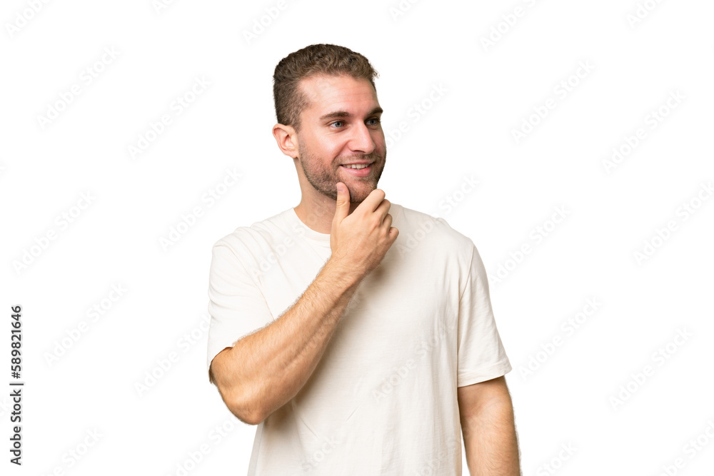 Young handsome caucasian man isolated on green chroma background looking to the side and smiling Young handsome caucasian man isolated on green chroma background looking to the side and smiling