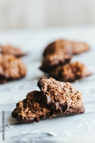 Closeup shot of no bake cookies dipped in chocolate on the marble kitchen counter