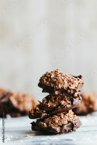 Closeup shot of a stack of no bake cookies dipped in chocolate on the marble kitchen counter