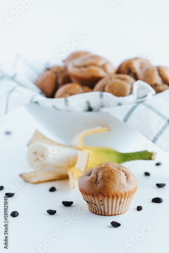Vertical shot of blueberry muffins on the white background