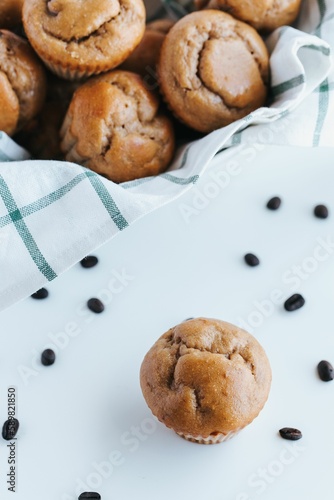 Vertical shot of blueberry muffins on the white background