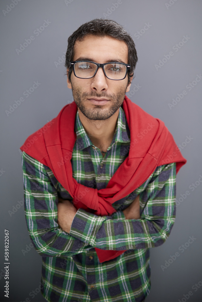 Fototapeta premium Thoughtful caucasian young man in glasses, looking into empty copy space thinking,