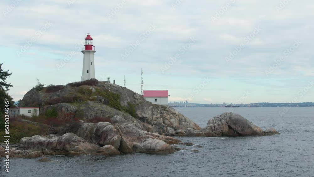 Drone shot of a the Point Atkinson Lighthouse on the coastline of the blue sea, British Columbia Drone shot of a the Point Atkinson Lighthouse on the coastline of the blue sea, British Columbia