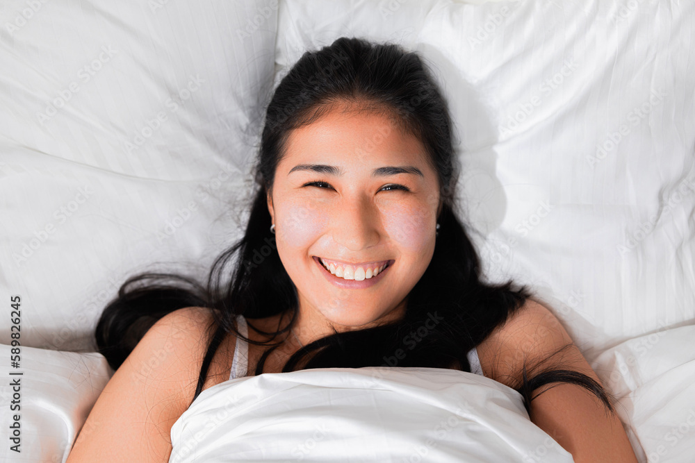Top view of young cheerful delighted adorable young japanese kazachstan chinese lady in bed waking up awaking after good dream smiling at camera ready for had day happy morning. Top view of young cheerful delighted adorable young japanese kazachstan chinese lady in bed waking up awaking after good dream smiling at camera ready for had day happy morning.