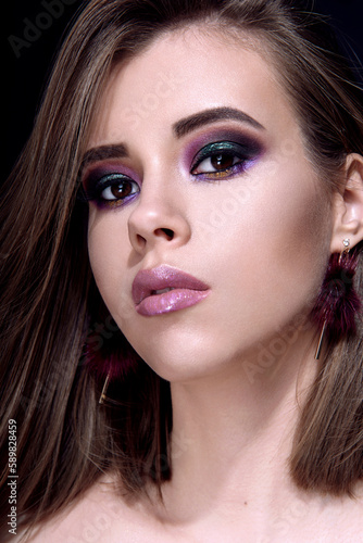 Beautiful woman with bright multicolor celebration make up Chic evening make-up. Fashion retouched portrait.