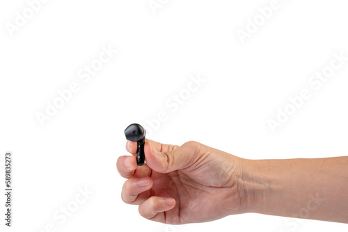 Wireless black bluetooth earphones in hand isolated close-up on a transparent background