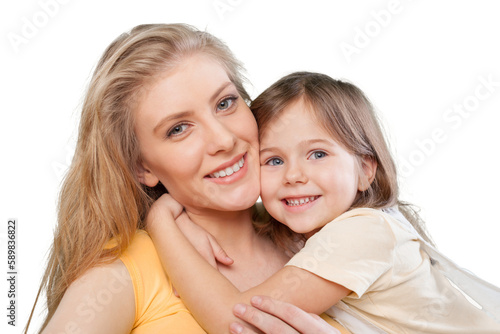 Happy mother and young daughter hugging each other