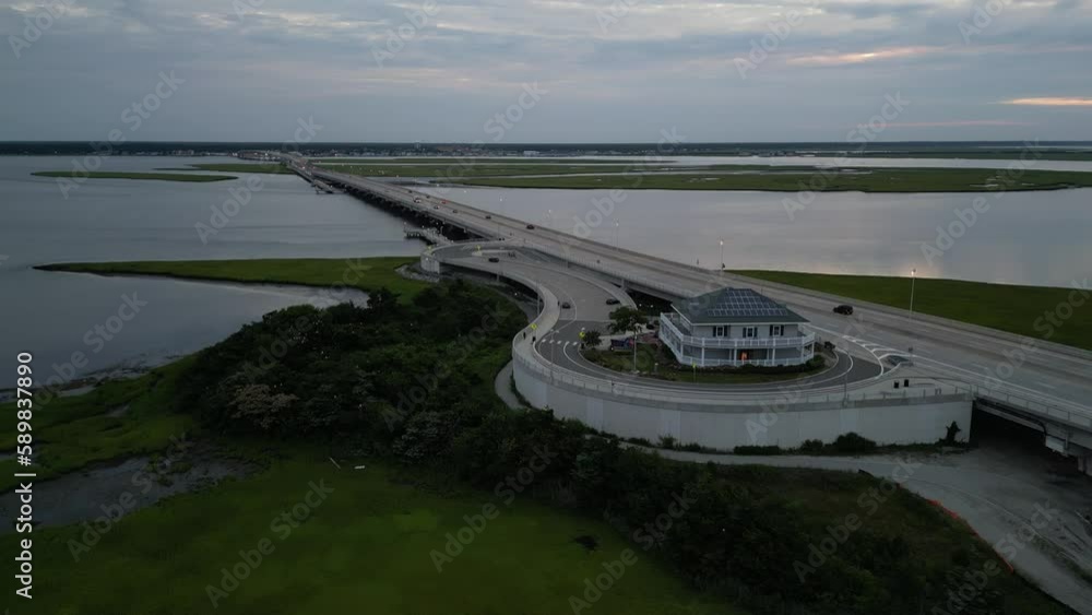 Beautiful drone view of a road with cars on a bridge during sunset Beautiful drone view of a road with cars on a bridge during sunset