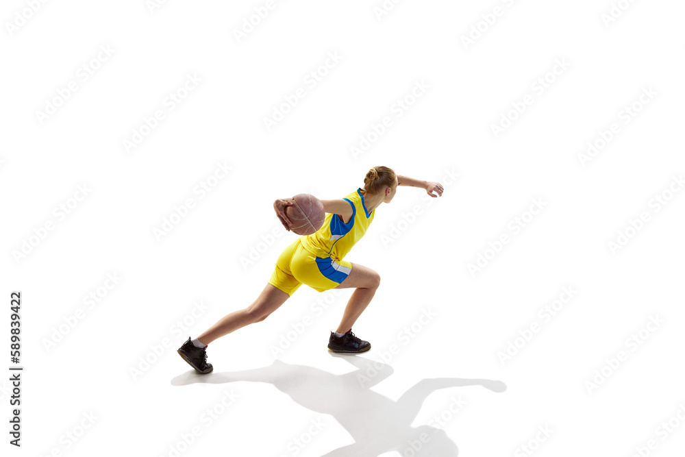 Dynamic top image of young sportive girl, training, playing basketball against white studio background. Isometric view. Concept of professional sport, hobby, healthy lifestyle, action and motion