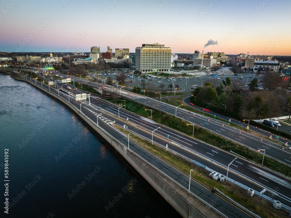 Drone shot of Trenton cityscape with the river at sunrise in New Jersey