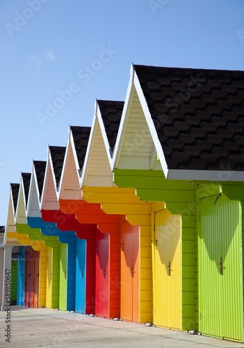 Scenic vertical shot of Colorful Holiday Huts on the East Coast of England