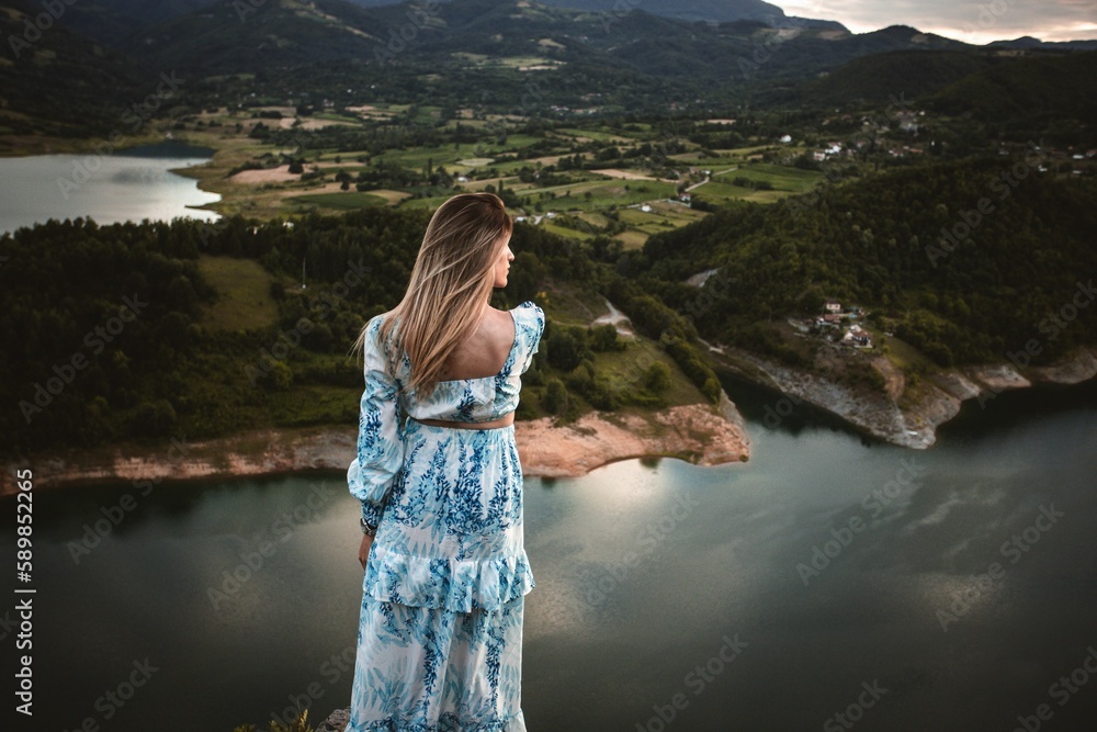 Caucasian female model in the mountains enjoying the view Caucasian female model in the mountains enjoying the view