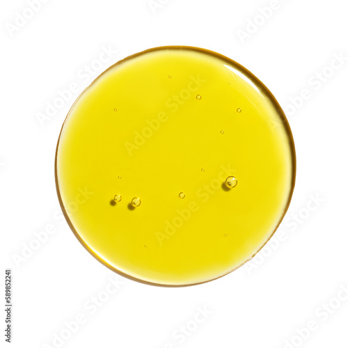 Drop of yellow oil swatch texture in petri dish macro with bubbles, cosmetics for face and body, science, laboratory isolated on white background