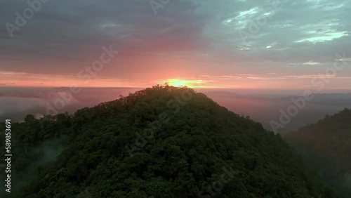 Aerial of mountains covered in trees at sunset in Mashpi biodiversity reserve, Ecuador.