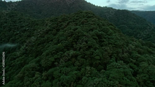 Aerial of mountains covered in trees in Mashpi biodiversity reserve, Ecuador.