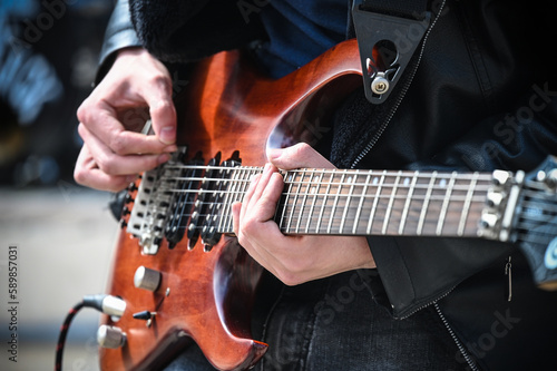 musician on the street with electric guitar