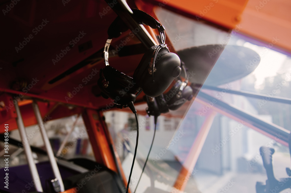 Photo of a small orange airplane for 2 people details