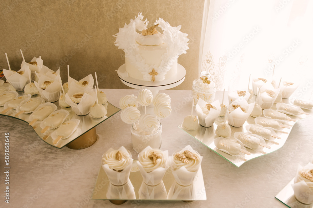 white cake and candy bar for baby's baptism