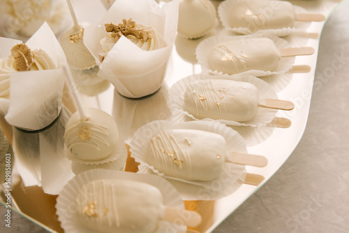 white cake and candy bar for baby's baptism