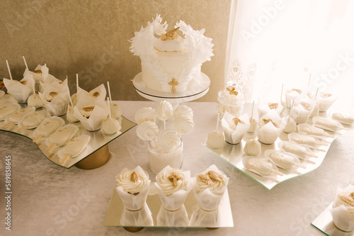 Obraz na płótnie white cake and candy bar for baby's baptism w salonie