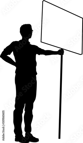 Protestor or demonstrator at a demonstration march, picket line or strike protest rally in silhouette. Holding up a banner or picket sign board placard.