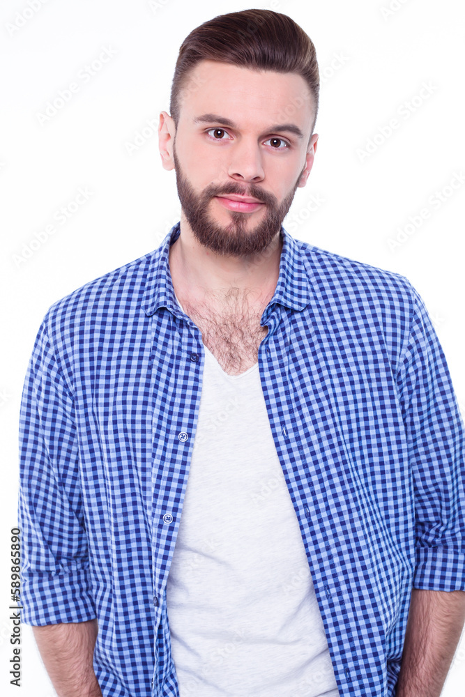 Strong, confident, handsome and bearded man in casual checkered shirt is posing isolated on white background with copy space for text and advertising Strong, confident, handsome and bearded man in casual checkered shirt is posing isolated on white background with copy space for text and advertising