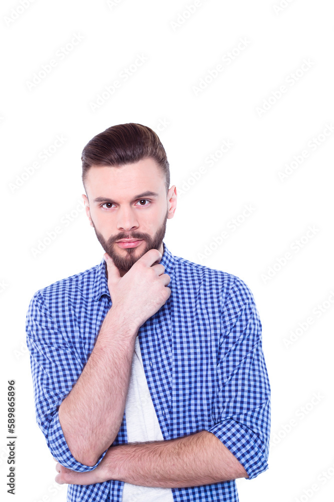Strong, confident, handsome and bearded man in casual checkered shirt is posing isolated on white background with copy space for text and advertising Strong, confident, handsome and bearded man in casual checkered shirt is posing isolated on white background with copy space for text and advertising