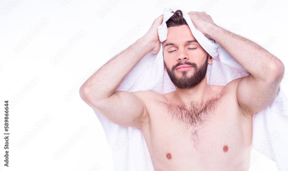 Young handsome bearded man after bath with white towel. Isolated photo of young naked guy. Young handsome bearded man after bath with white towel. Isolated photo of young naked guy.