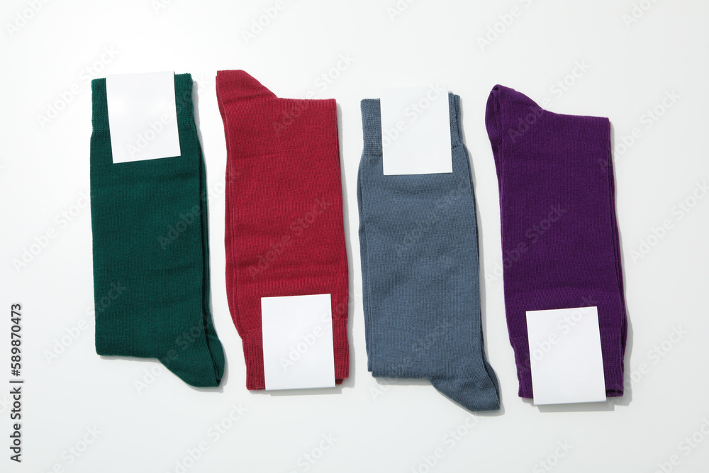 Socks with blank label on white background, space for text Socks with blank label on white background, space for text