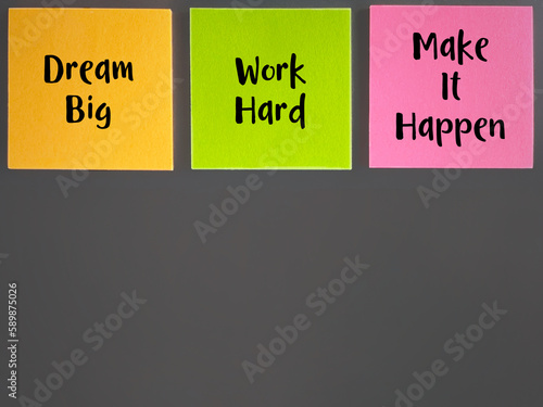Inspirational motivational quote for success. Dream big work hard make it happen text on stickynote background. photo