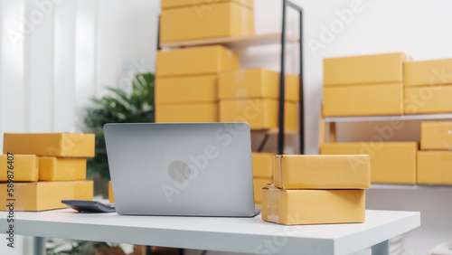 SME delivery cardboard box package on desk of warehouse.
