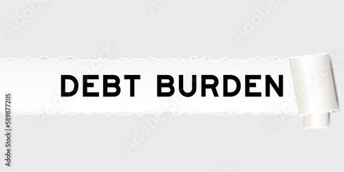 Ripped gray paper background that have word debt burden under torn part