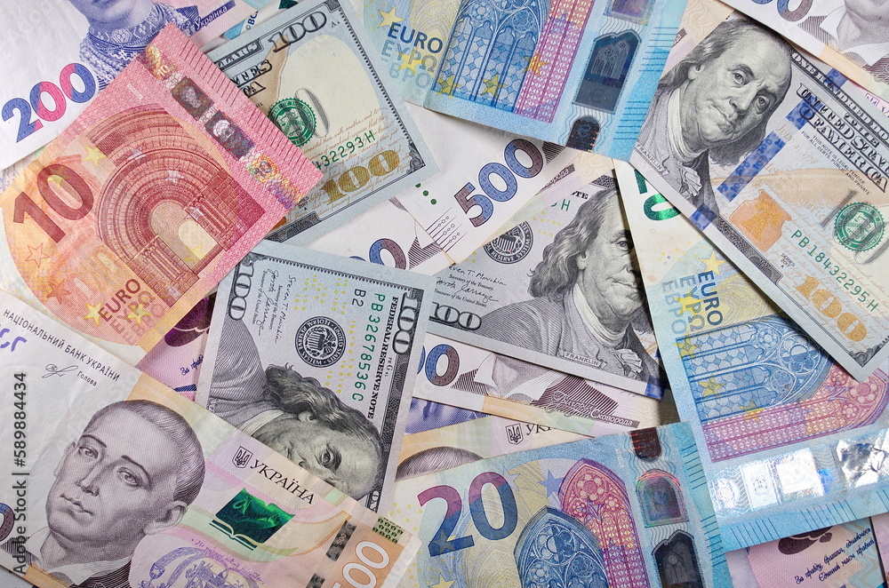Obraz premium Set of one hundred dollars banknotes euro hryvnia 500, 200 Uah Money and save concept Benjamin Franklin Paper money currency cash Finance payments close-up Free space for your text Credit concept