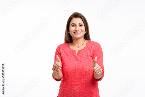 Canvastavla Young indian woman showing thumps up on white background.