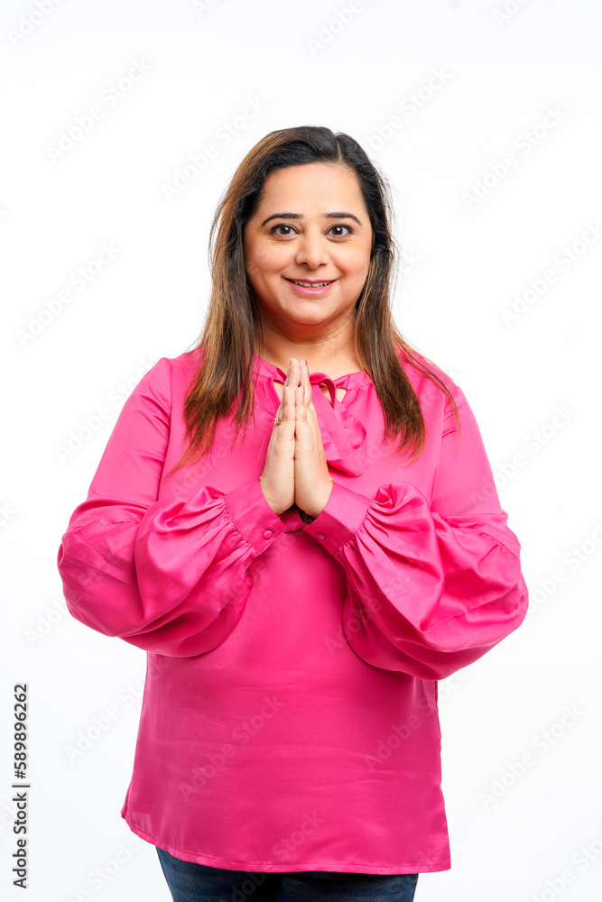 Indian woman giving namaste or welcome gesture on white background Indian woman giving namaste or welcome gesture on white background
