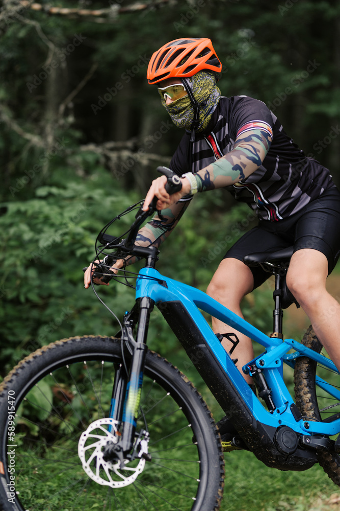 Mountain biker riding on bike in autumn inspirational mountains landscape banner. Man cycling MTB on enduro trail track. Sport fitness motivation and inspiration. Mountain biker riding on bike in autumn inspirational mountains landscape banner. Man cycling MTB on enduro trail track. Sport fitness motivation and inspiration.