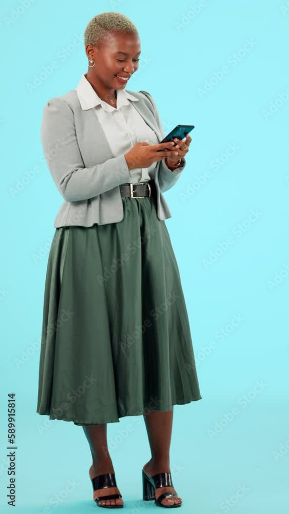 Typing, phone and business black woman on blue background on social media, internet and mobile app. Communication, network and girl on smartphone for chatting, text message and internet in studio Typing, phone and business black woman on blue background on social media, internet and mobile app. Communication, network and girl on smartphone for chatting, text message and internet in studio
