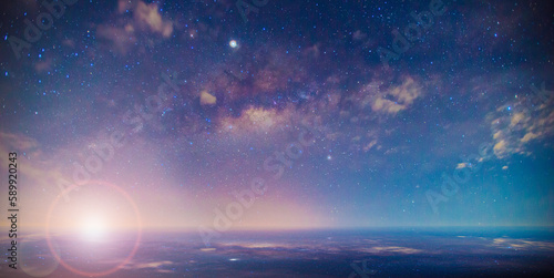 Panorama blue night sky milky way and star on dark background.Universe filled with stars, nebula and galaxy with noise and grain.Photo by long exposure and select white.with lens flare.