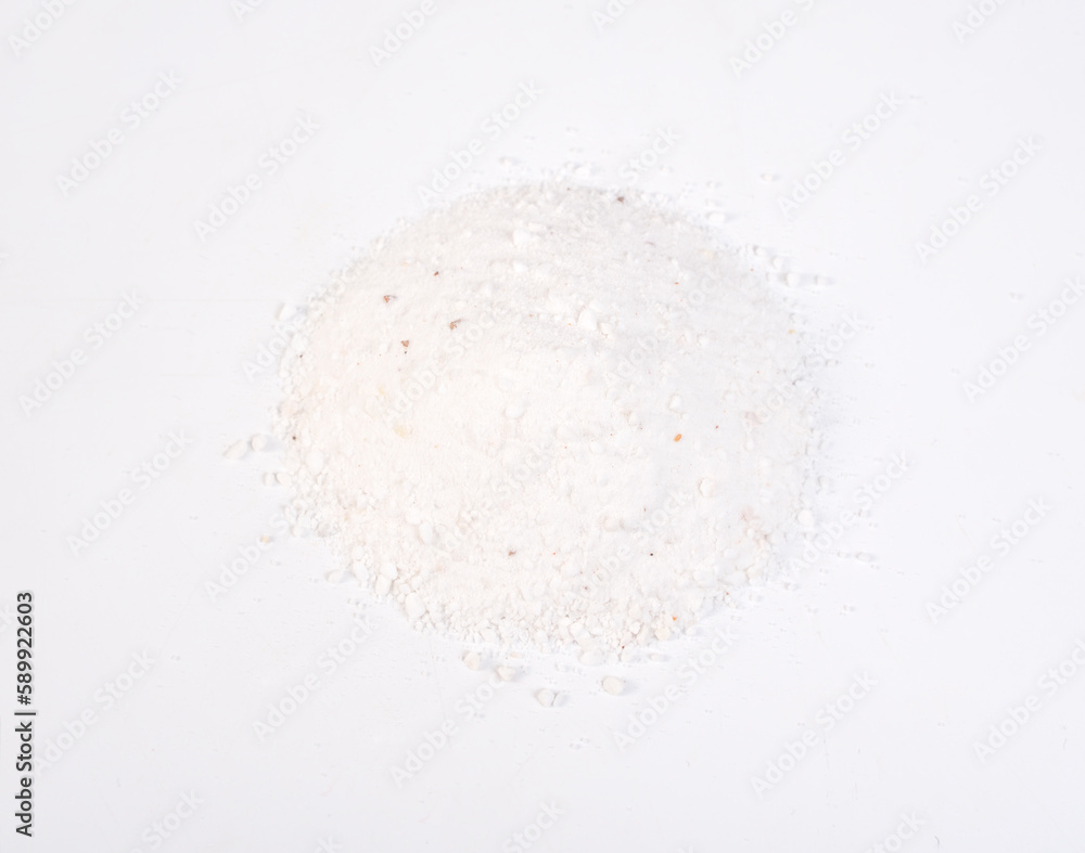 Dolomite mineral powder heep on white background.