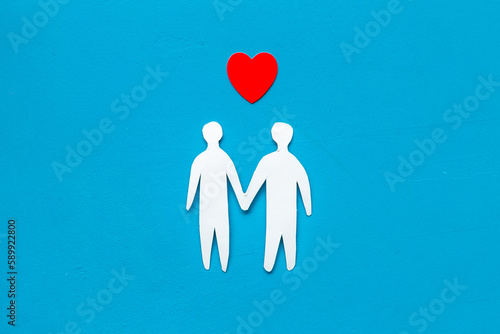 LGBT couple - two men paper shapes with red heart. LGBT social rights concept.