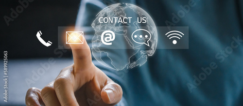 Hand of call center touching on screen contact us, email, address, operator, customer, suppor, phone services agen, customer support hotline.contact us concept